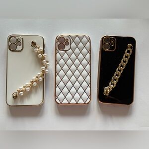 Set of 3 iPhone 11 cases. 2 have a holder for your hand to carry.